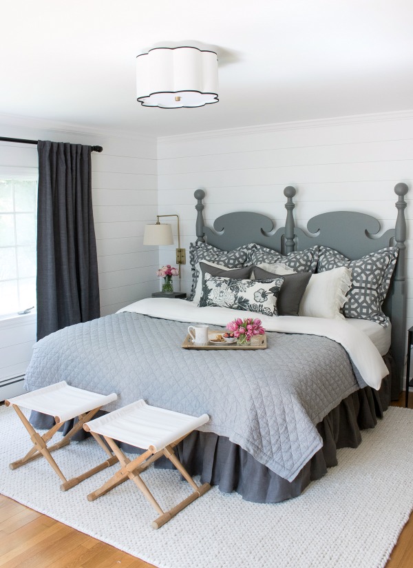 Master bedroom makeover with planked walls painted in Farrow & Ball All White and soothing neutral decor. A HUGE change from the before pics in this post!