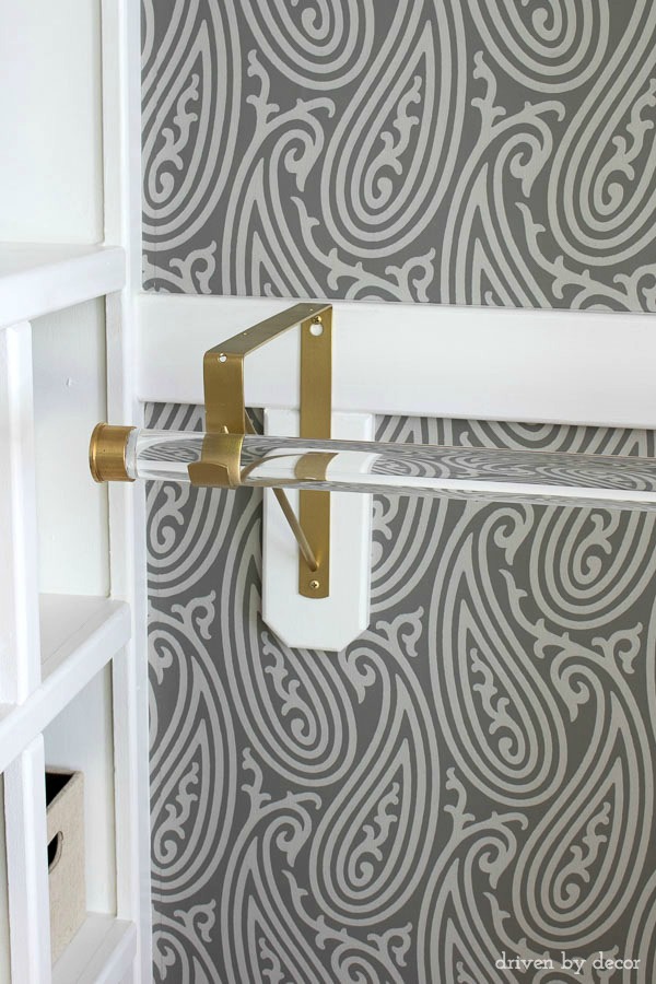 Acrylic closet rods with gold hardware are part of this glam closet makeover