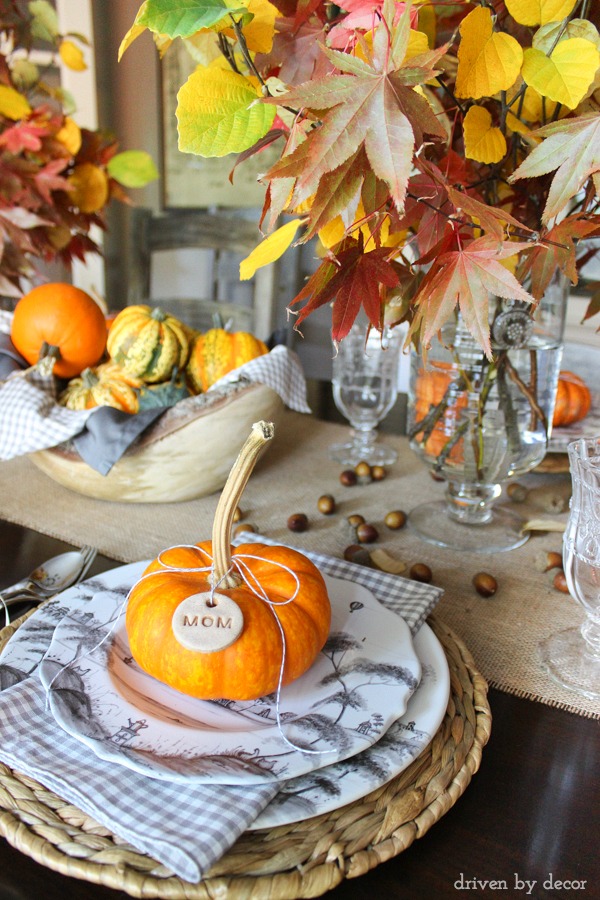 Easy to make dough tags tied onto mini pumpkins are part of this pretty fall tablescape