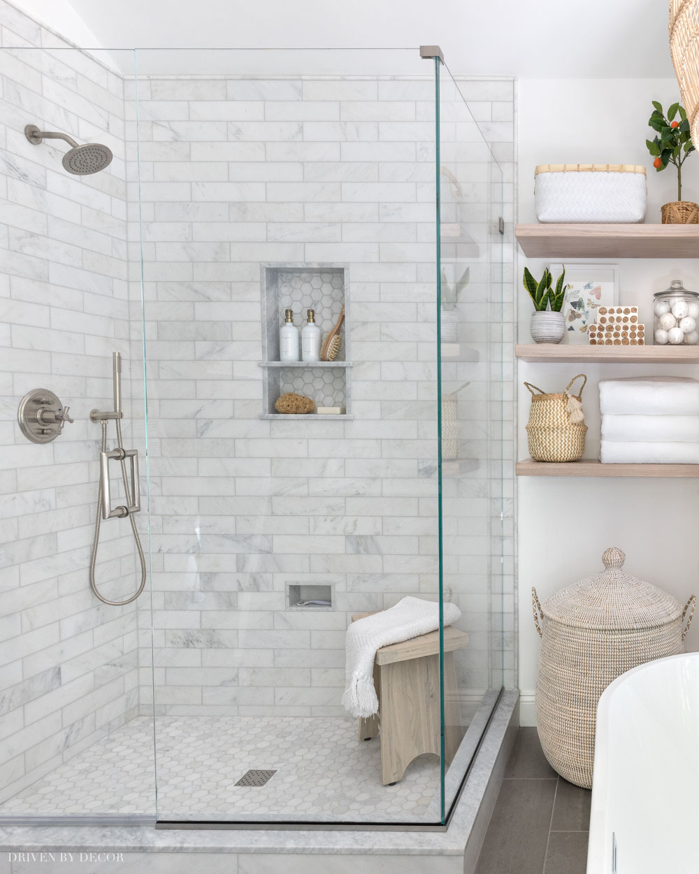 Love how she mixed metals with the brushed nickel finish of her shower hardware + brass accents in other parts of the bathroom