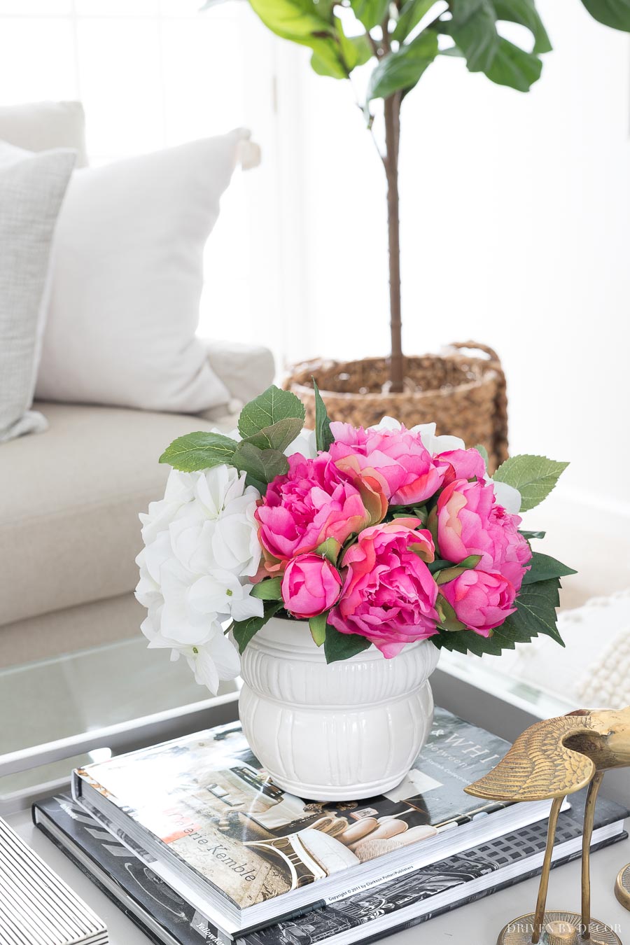 These faux peonies and hydrangeas in a simple white planter are beautiful as coffee table decor!