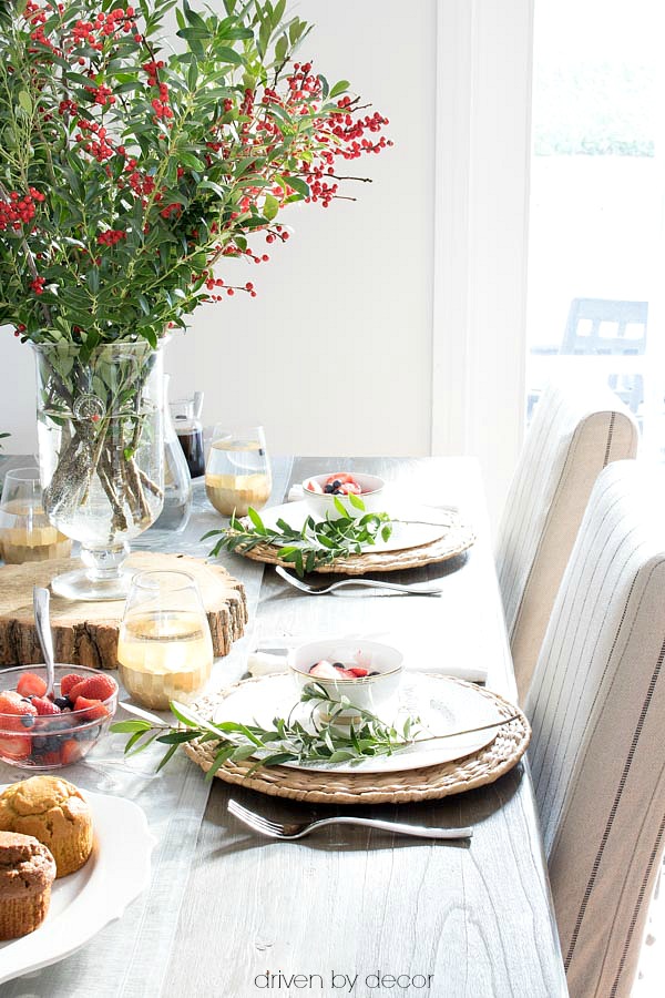 A simple holiday brunch tablesetting with boxwood branches for greenery