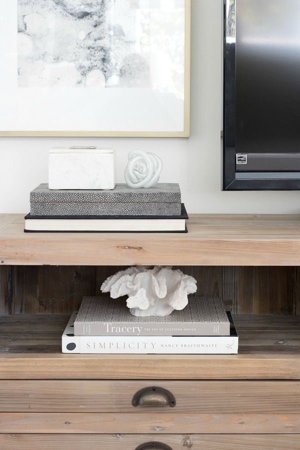 Books and accessories on media console