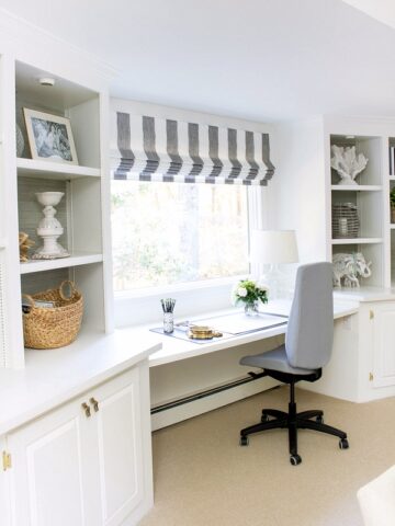 Desk area with window between two built-in bookcases