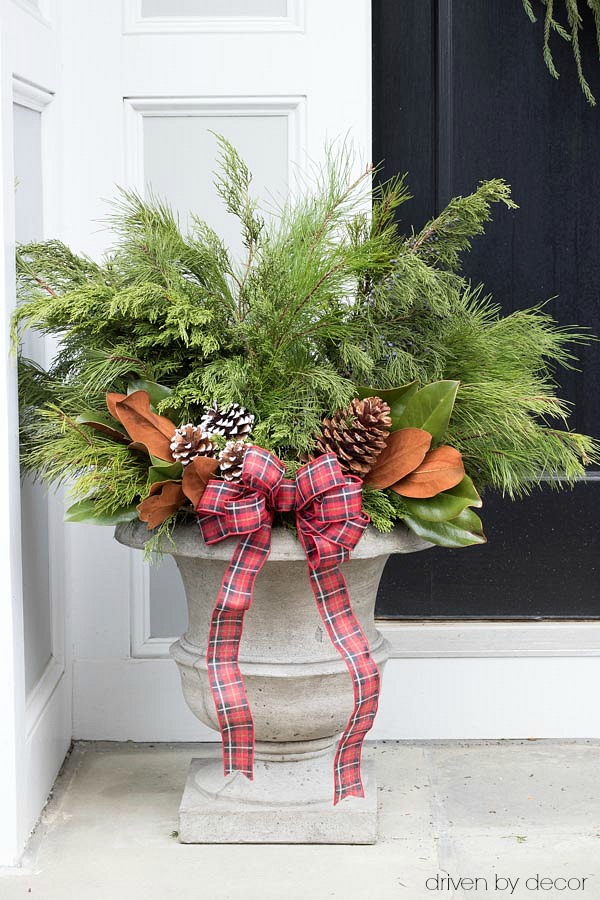 Christmas home tour - create festive Christmas / winter planters by adding greenery branches and pinecones to a pair of planters