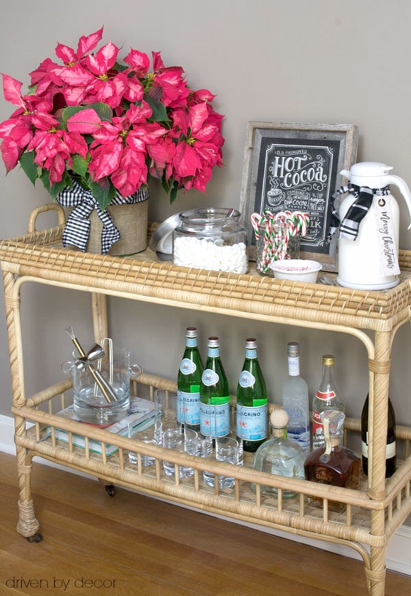A rattan bar cart used for a Christmas hot chocolate station