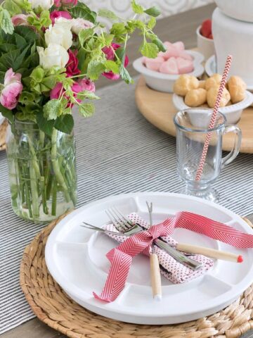 Fondue forks and Valentine's Day napkin tied with ribbon for a simple fondue feast placesetting!