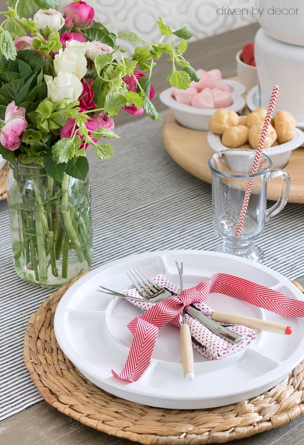 Fondue forks and Valentine's Day napkin tied with ribbon for a simple fondue feast placesetting!