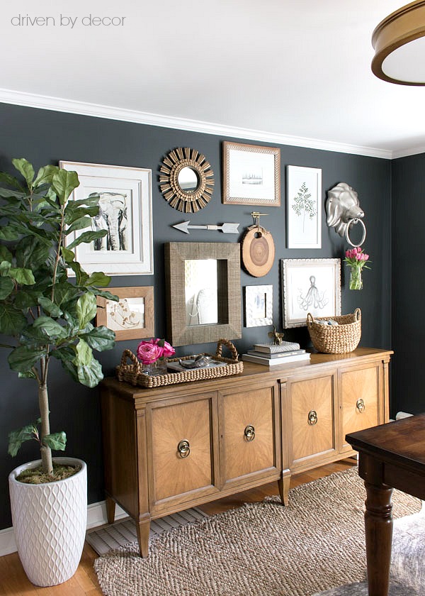 Great post with tips on how to create your own art gallery wall plus the before and after of this gallery wall arrangement with art prints and mirrors above a vintage console!