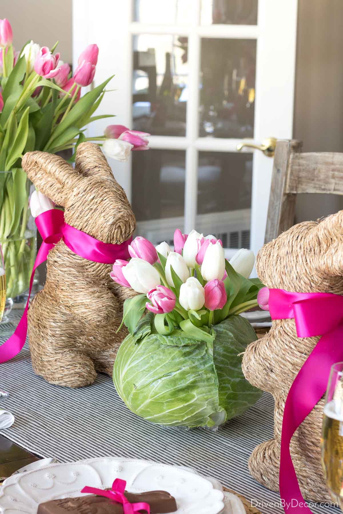 Twine Easter bunnies flanking a tulip filled cabbage