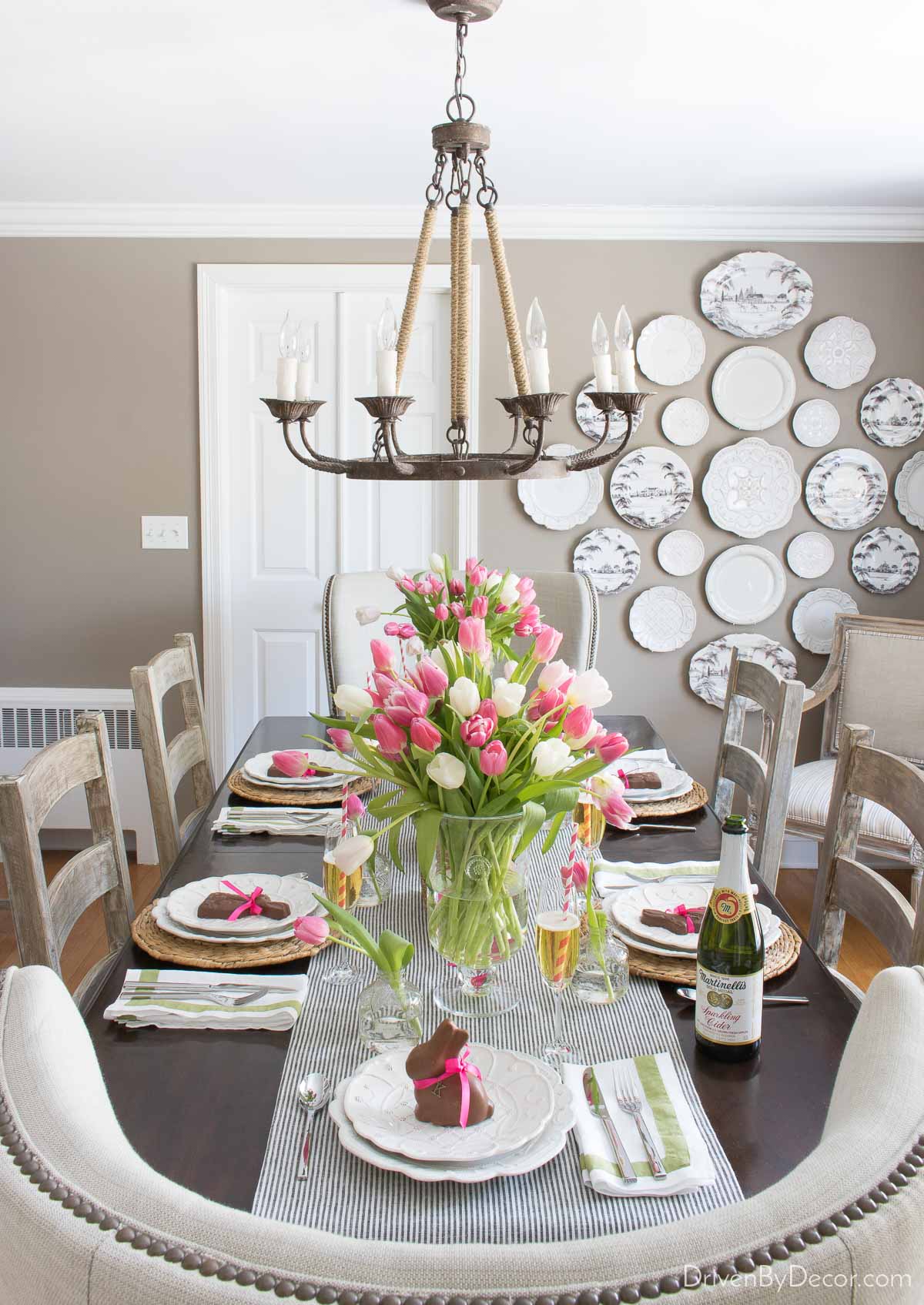 Dining table decorated for Easter with tulips and chocolate bunnies