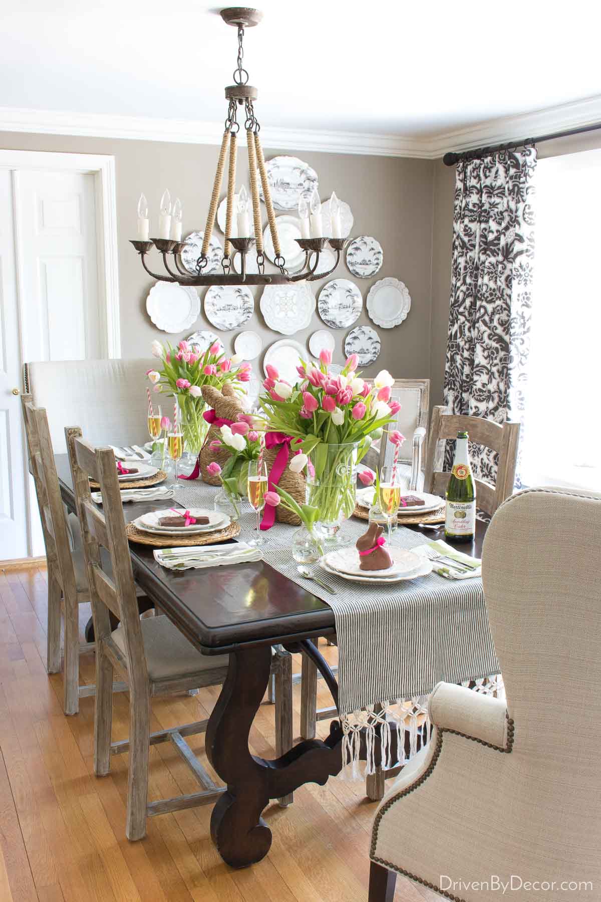 Easter table with vases of tulips and bunny decor