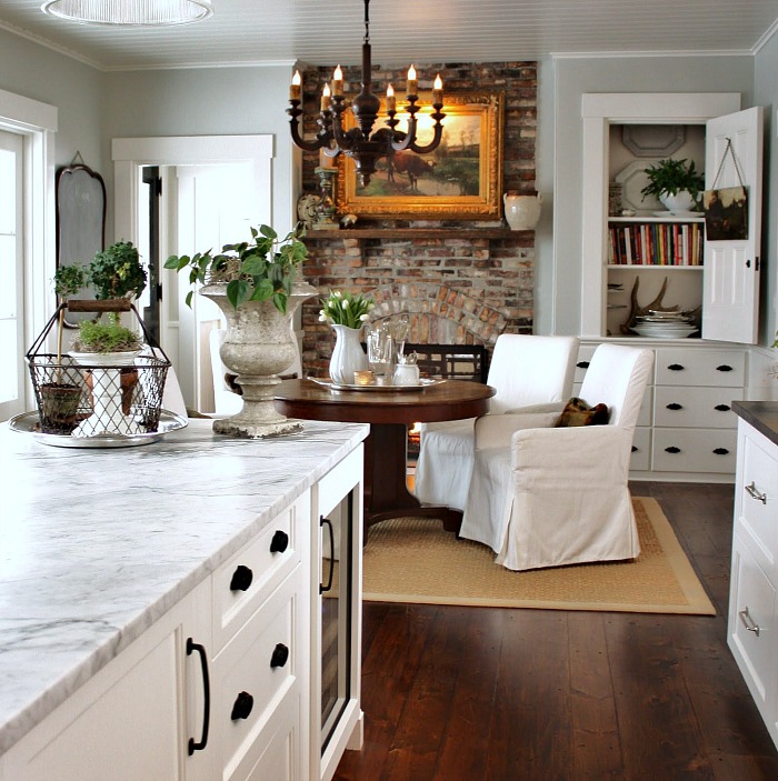 Gorgeous breakfast nook with brick fireplace - For the Love of a House