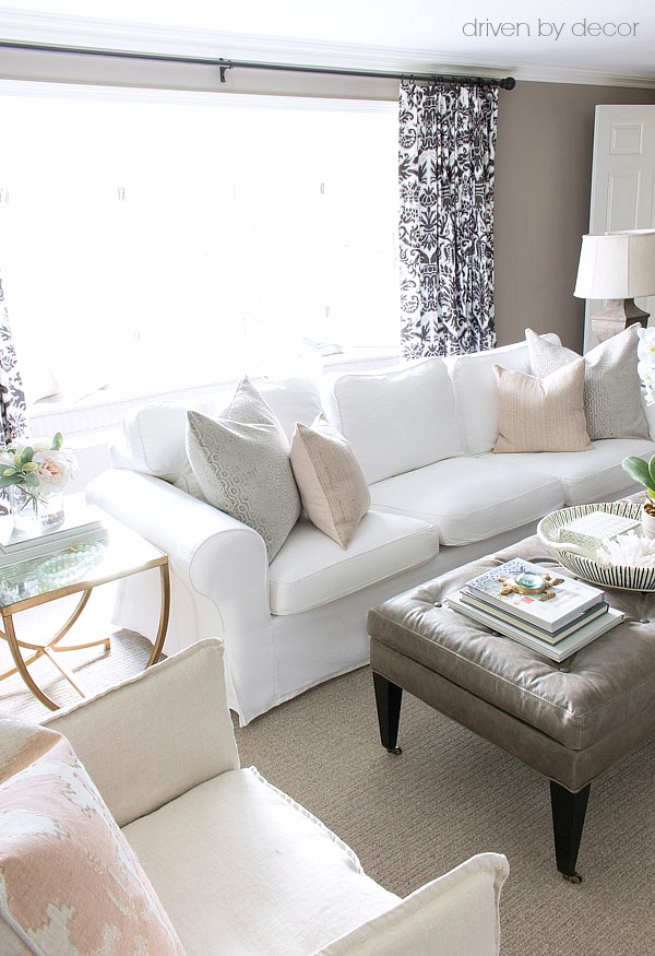 IKEA Ektorp sofa with gray and soft blush pillows