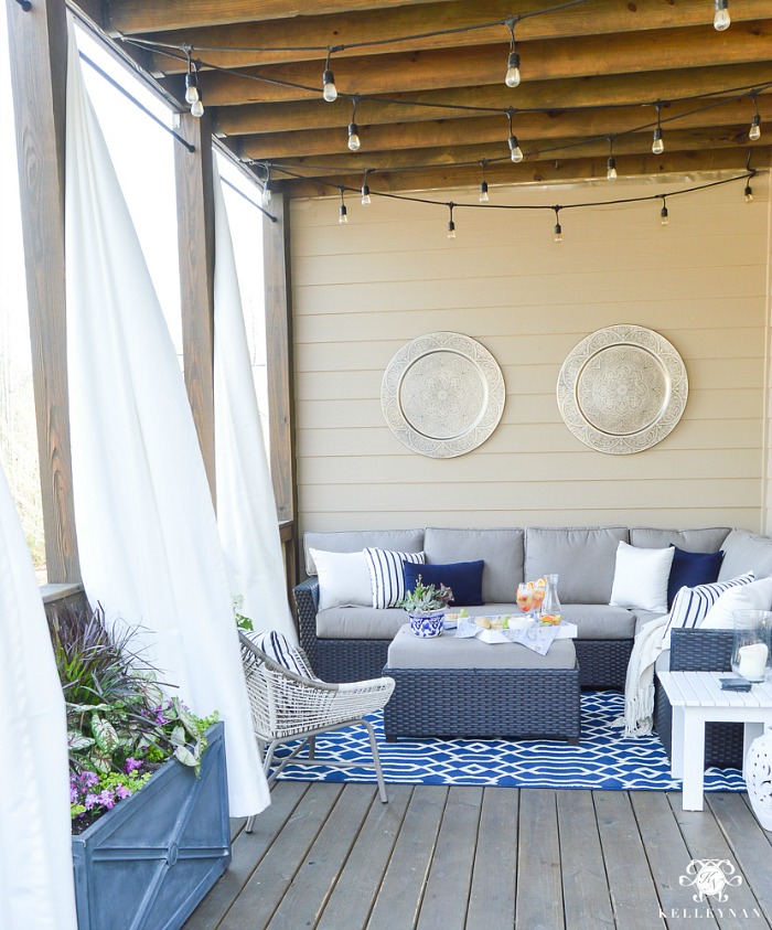 Love these gold medallions hung on this wall in this gorgeous outdoor space by Kelley Nan