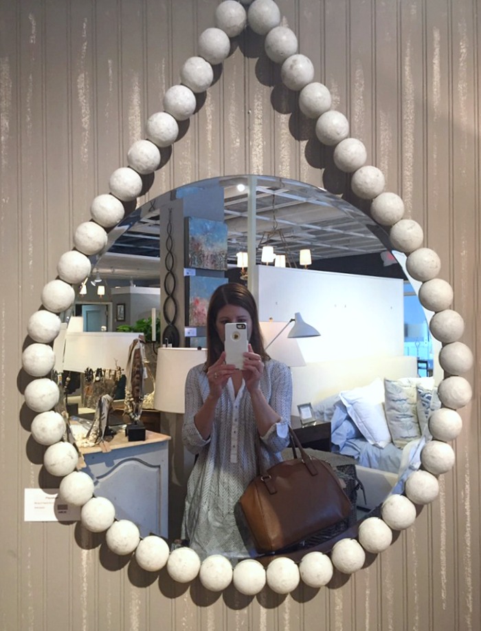 Round mirror surrounded by large wood beads - love!