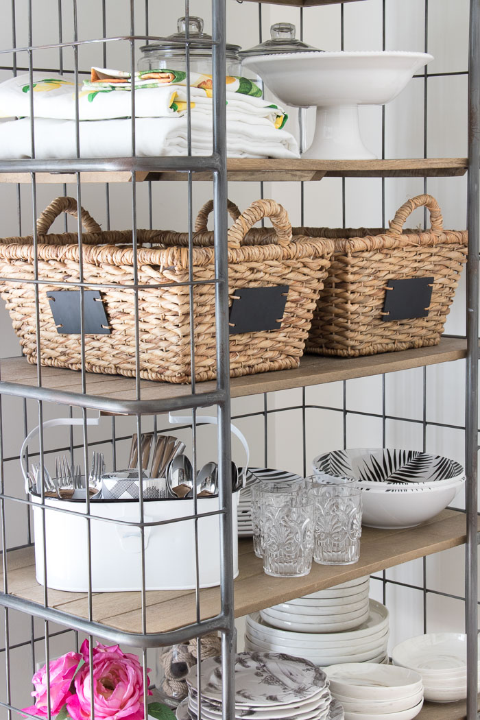 Ideas for using and decorating your baker's rack - lidded glass jars, chalkboard baskets, dinnerware, tablecloths, and more