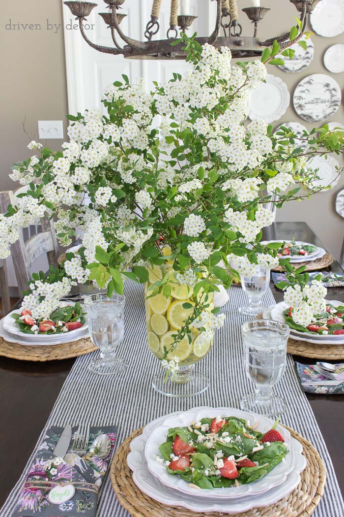 Create a simple centerpiece with flowering branches and a lemon filled vase - this post has a great tip for the easy way to do it!