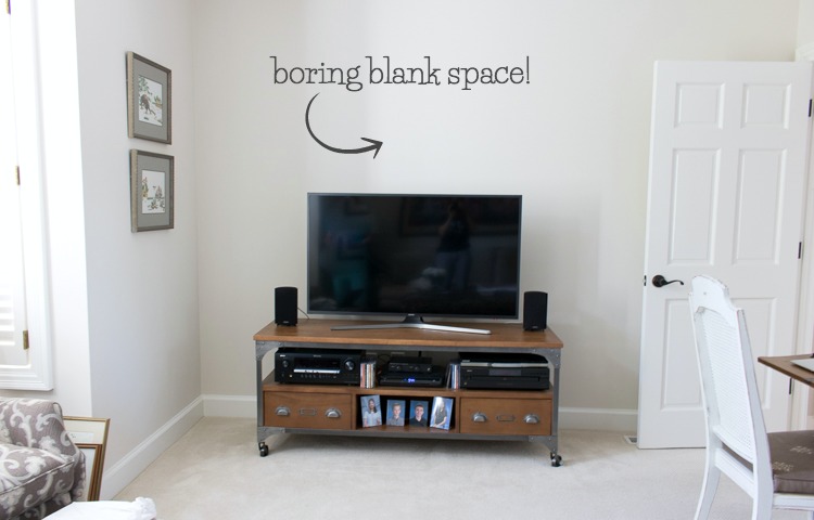 Pic of blank space above the TV before we decorated it! Click over for the "after"!