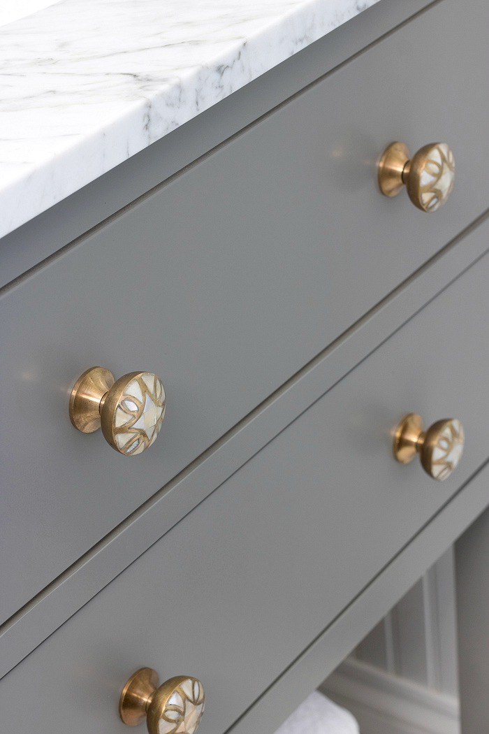 A great way to dress up a bathroom vanity is by simply switching out the knobs! Love these brass and mother of pearl beauties!