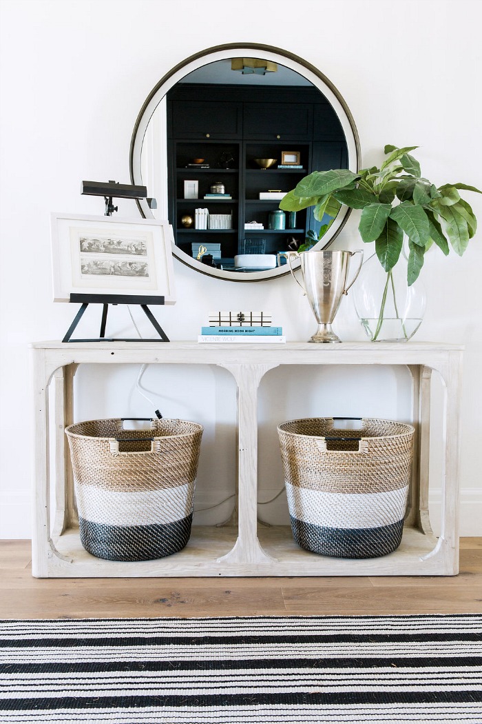 Foyer console with open bottom for baskets storing shoes - so smart!