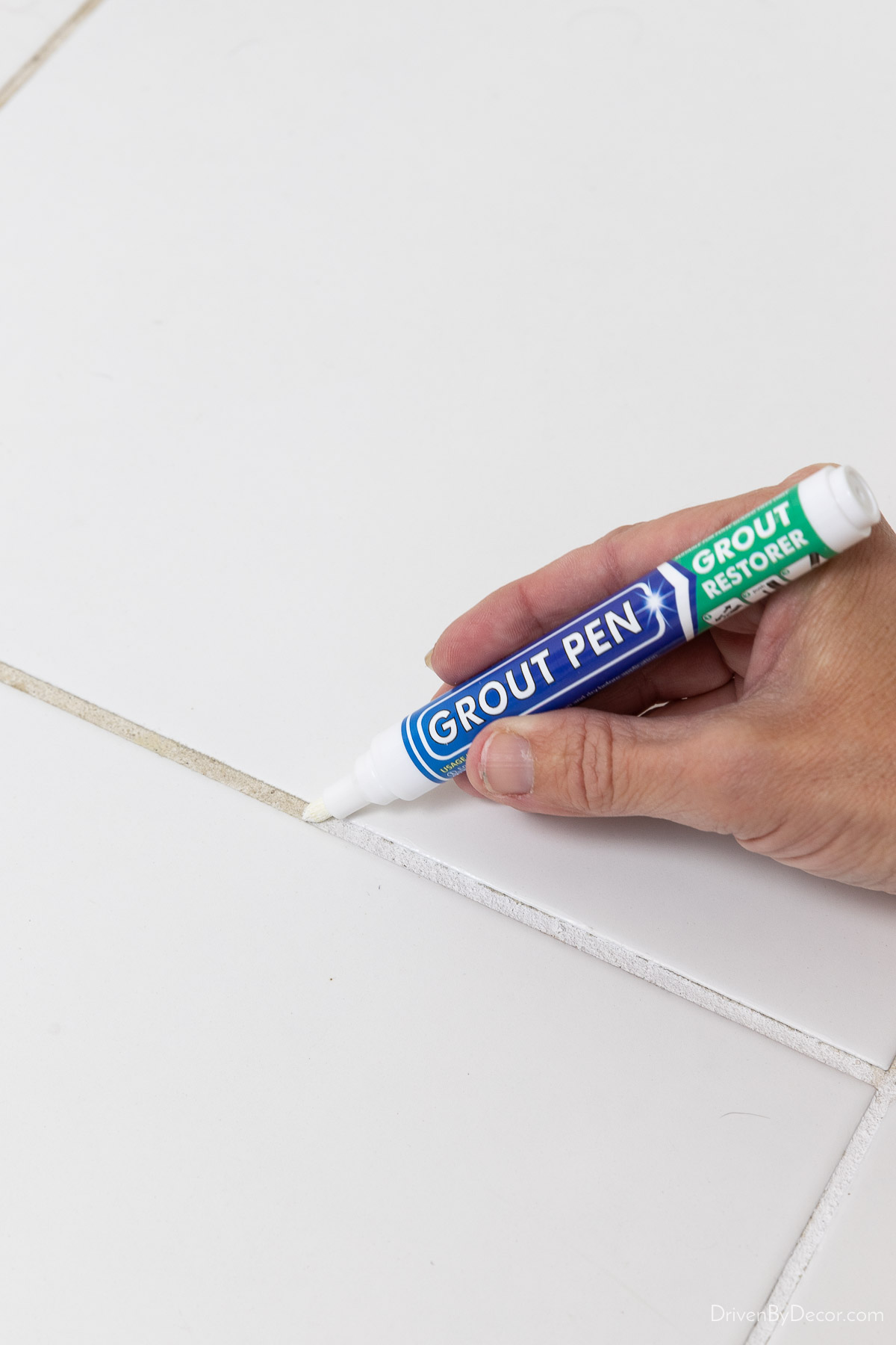 Using a grout pen to whiten grout
