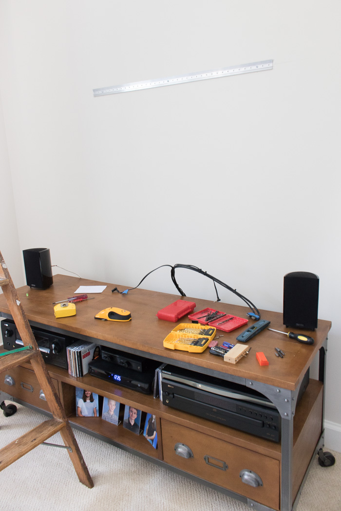 Hanging an art ledge shelf above a TV and media console