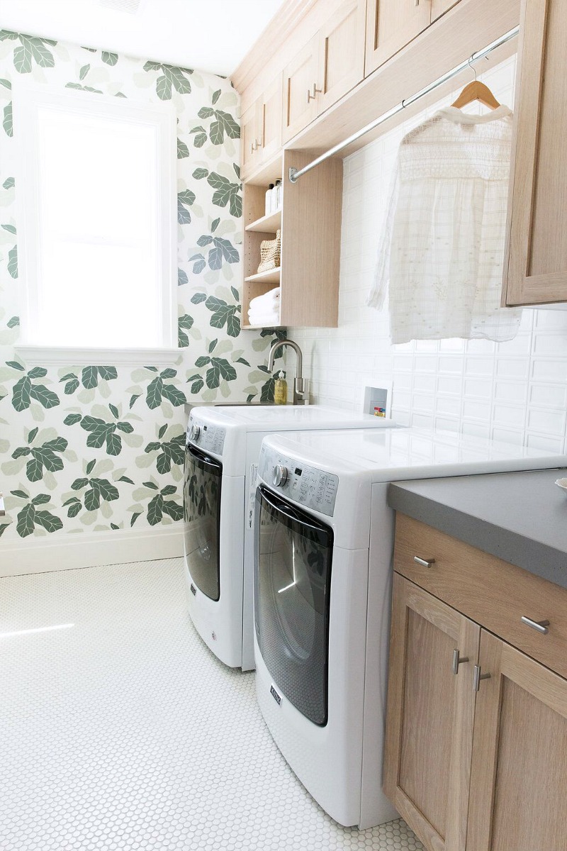 Love both the design and function of this laundry room - I need that hanging rack over the washer and dryer!