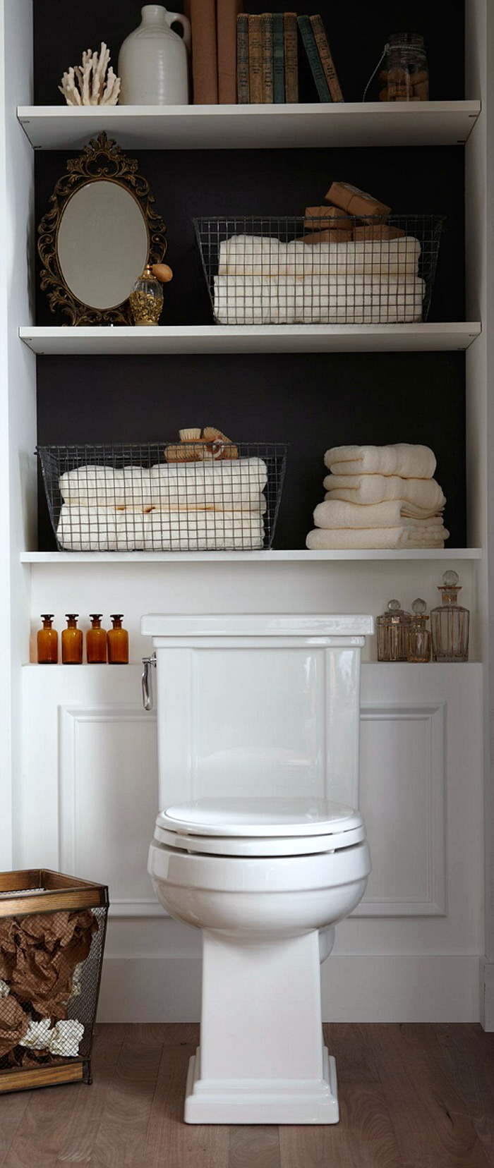 Adding built-in or freestanding shelving behind the toilet is a great way to add some extra storage in a small bathroom!