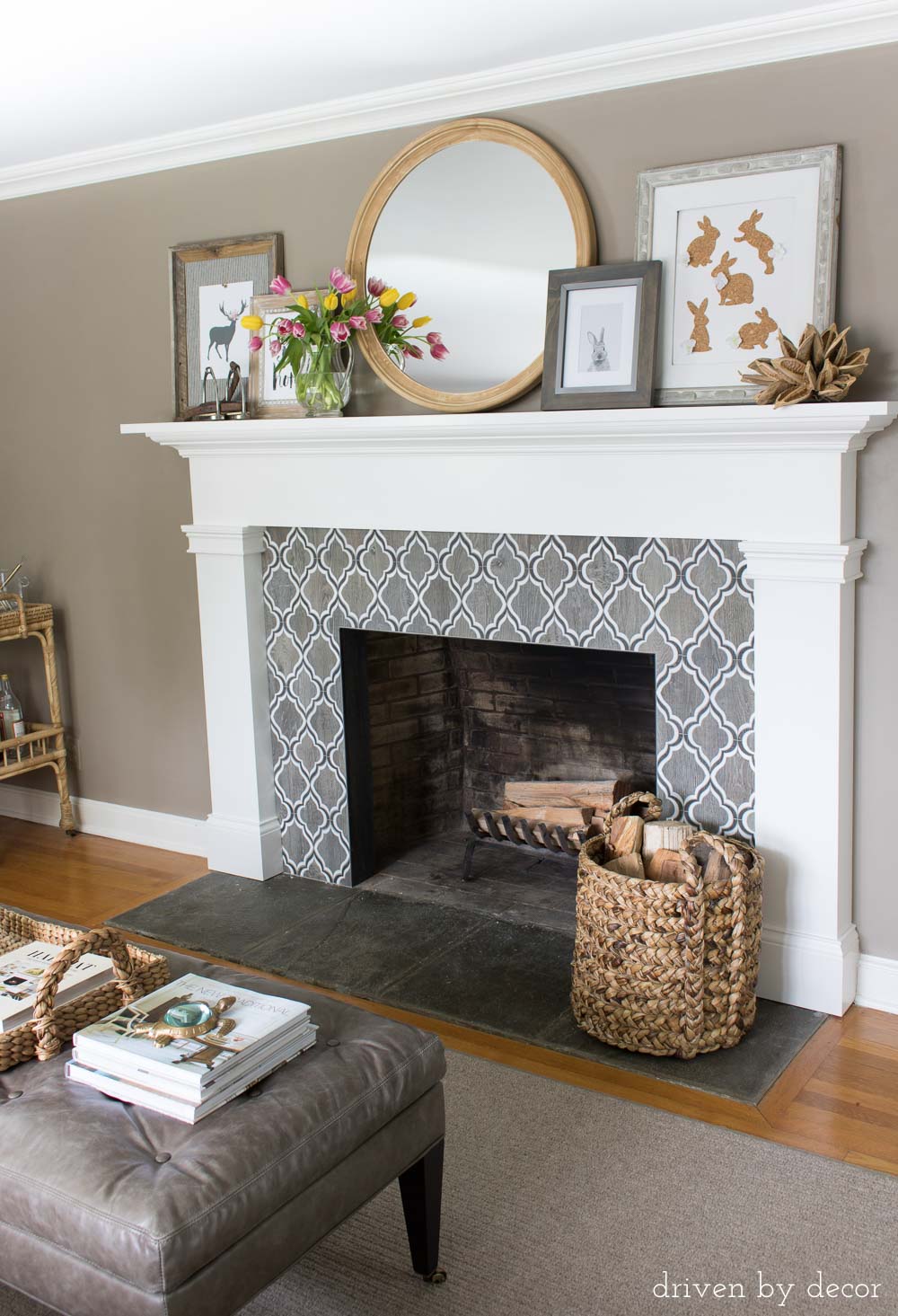 Love the patterned tile fireplace surround and layered mantel art!