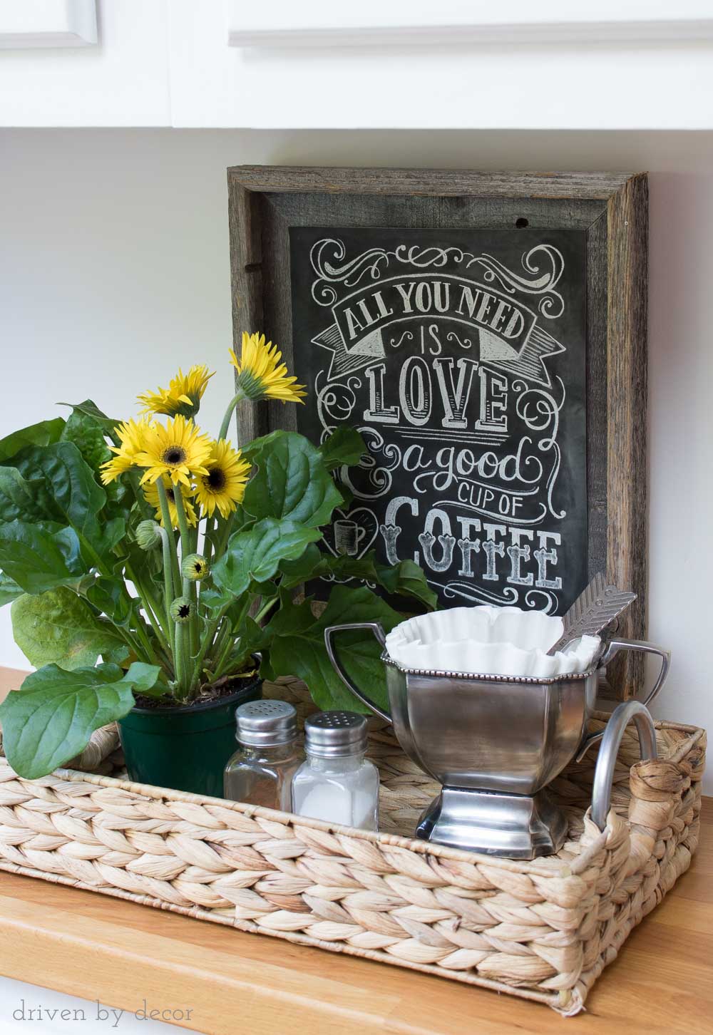 Simple coffee station in woven tray - coffee filters held in trophy cup (love the heart coffee scoop!) and cute chalkboard coffee print!