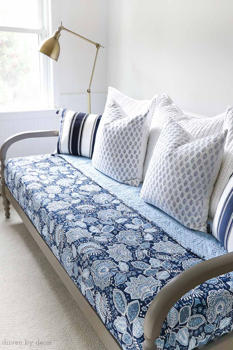 Great tips on where to start when decorating your bedroom. Love the combination of this colorful Vera Bradley bedding with the warm wood daybed and brass floor lamp!