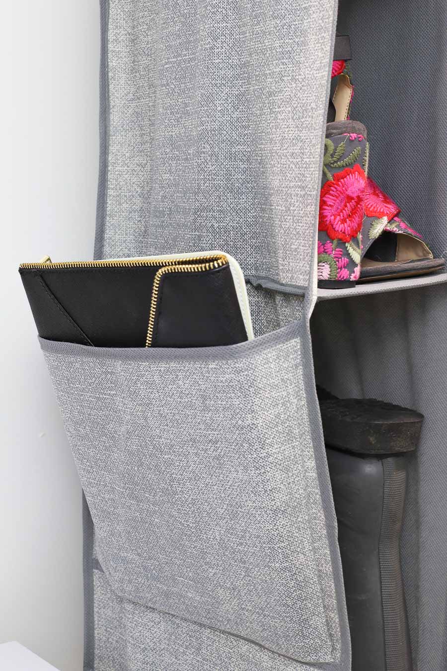 Storage pocket on the side of a hanging shoe and boot organizer - smart organization idea!