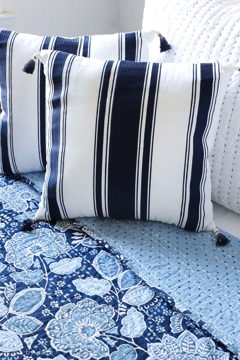 Loving the combination of the gorgeous blue and white Vera Bradley floral quilt and the navy stripe tasseled pillows!