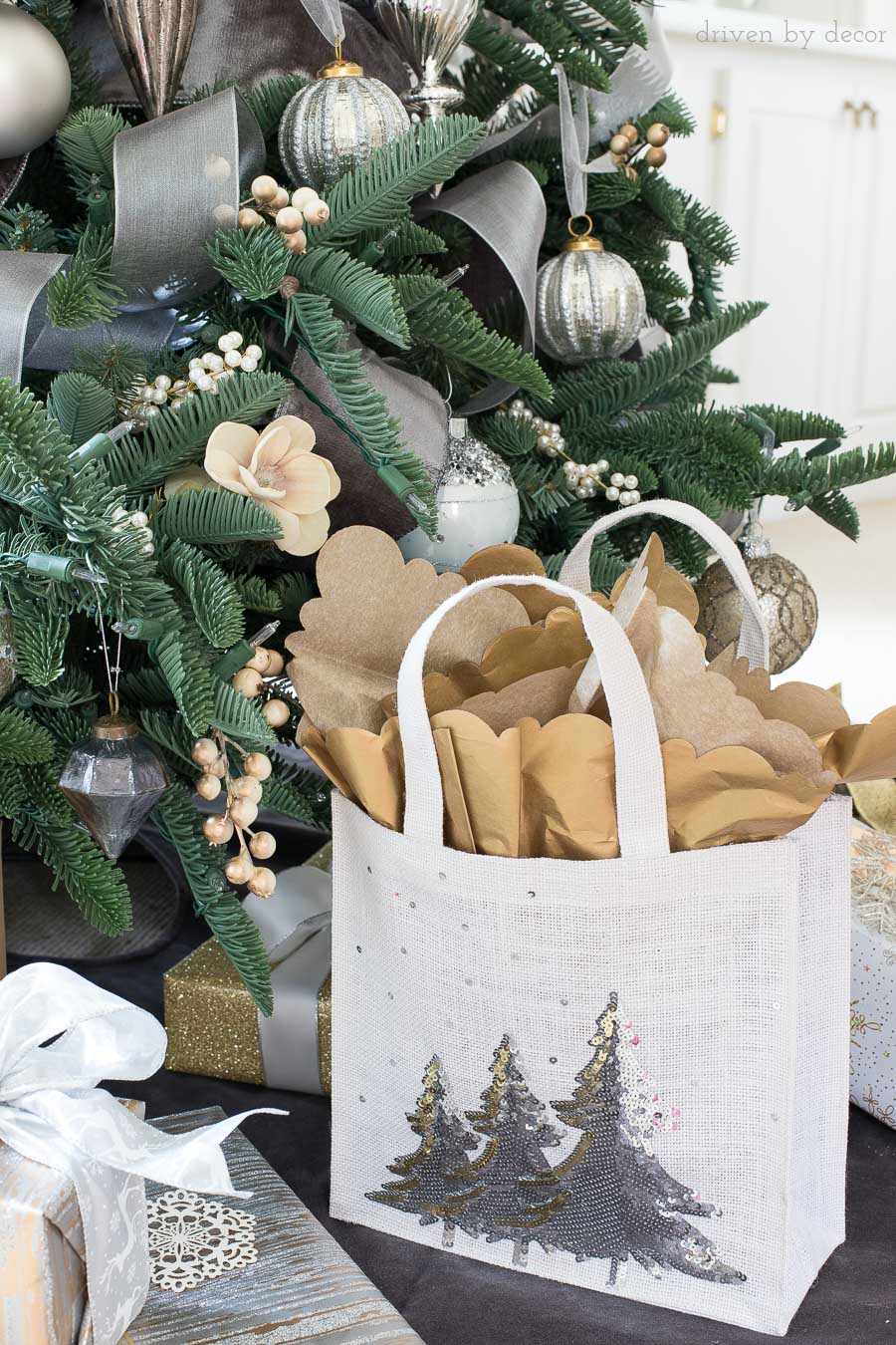 Adding tissue paper with a decorative edge to your gift bag takes it to the next level! Love all of the easy gift wrapping ideas in this post!