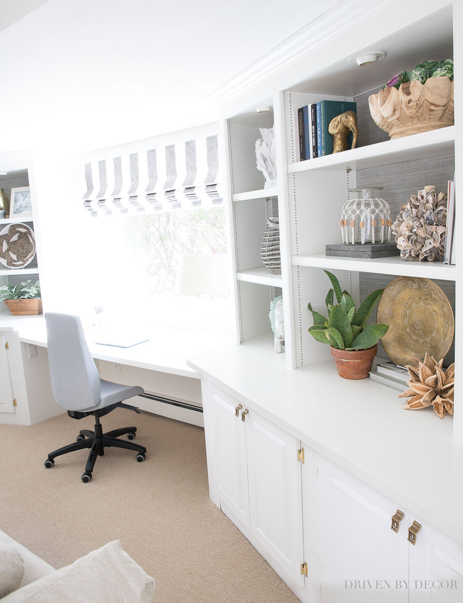 Built-in bookcases flanking desk and window in middle - a great arrangement for a family room!