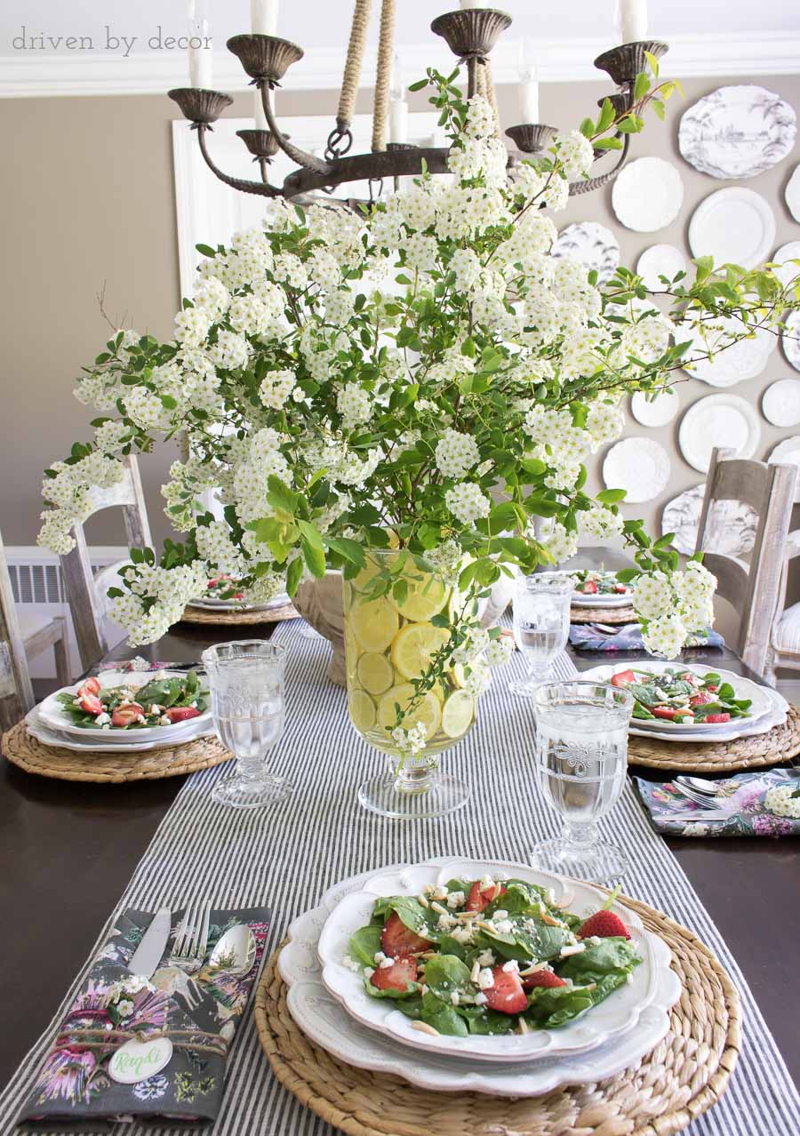 Slice lemons to line a vase for a beautiful, simple spring table centerpiece!