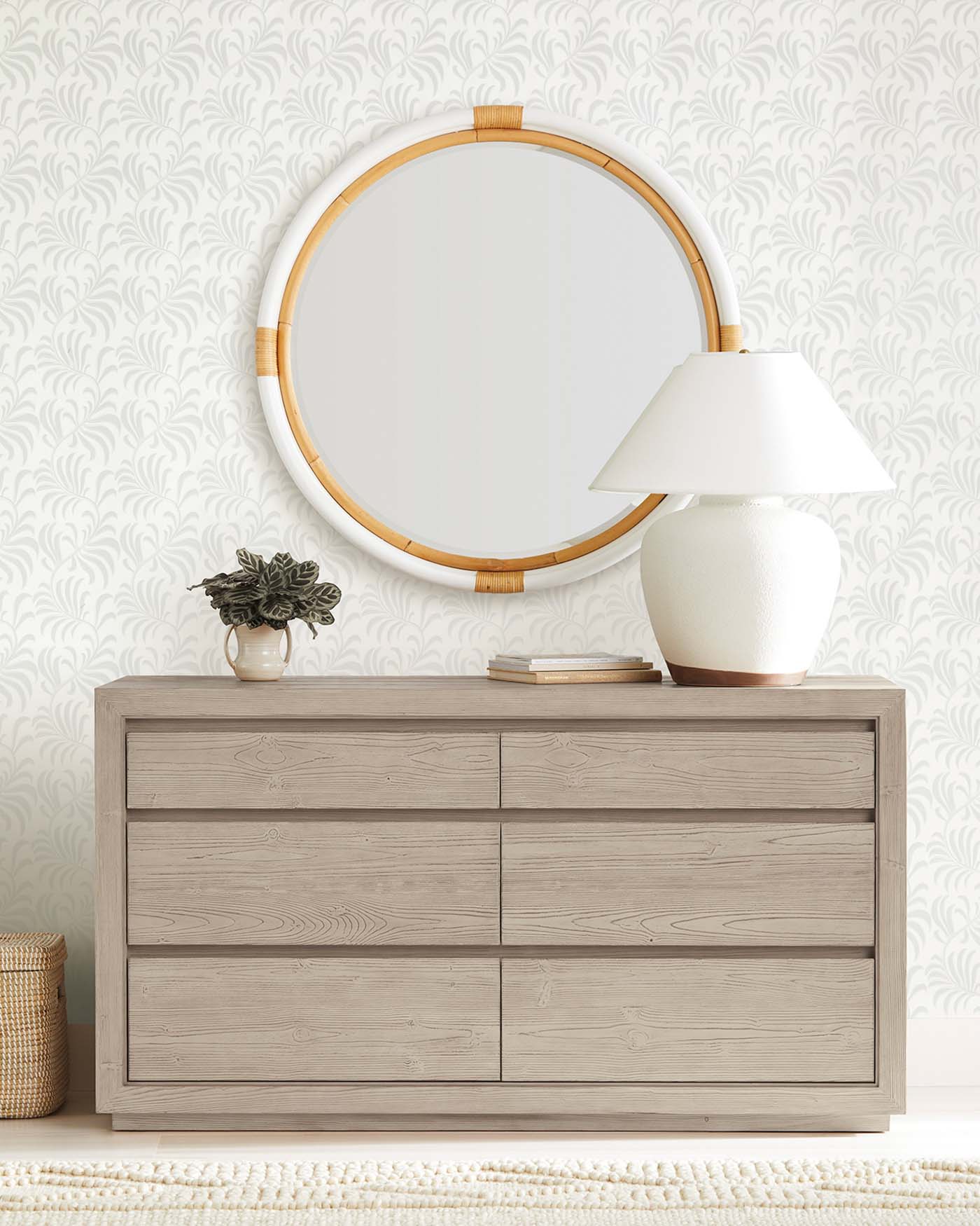 Love the look of the round rattan mirror over the dresser!