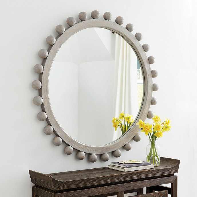 Statement-making round wood mirror - love the design and the graywash finish!