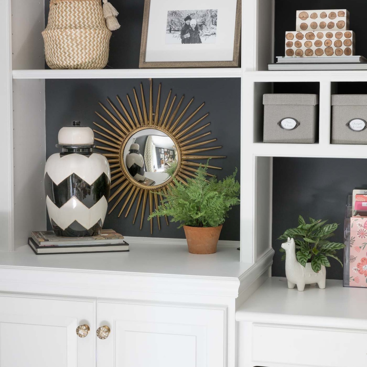 Love the starburst mirror she has on the back of her bookcase!