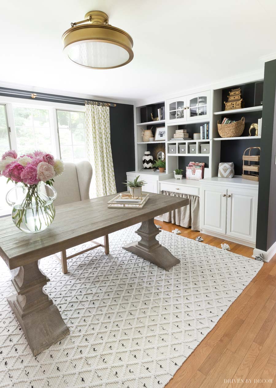 Love the gold starburst mirror hung on the back of our home office bookcase!