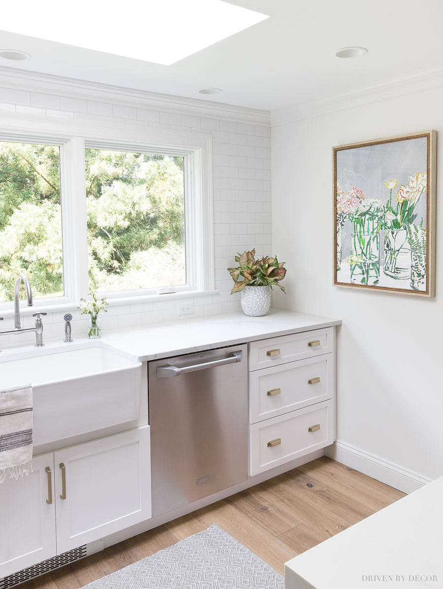 The perfect piece of art for a gray and white kitchen! Click through for source and more pics of this fabulous kitchen renovation!