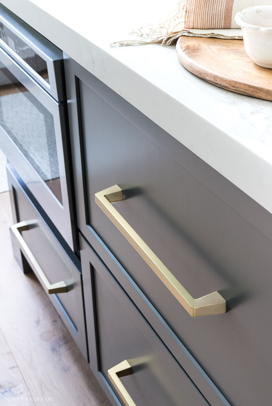 Beautiful soft brass pulls that look amazing on the gray cabinets (and on the white ones in this kitchen too!)