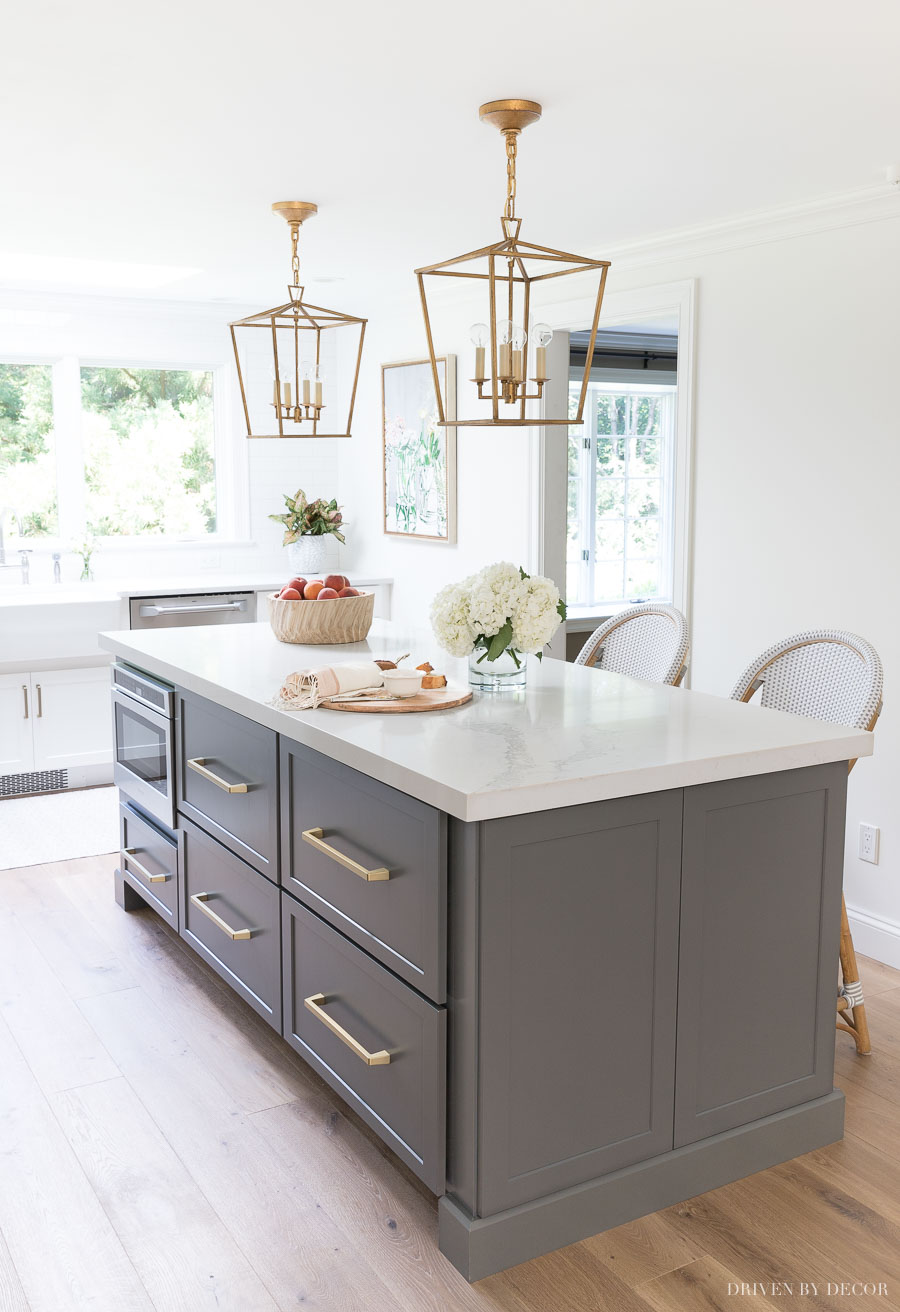 Loving all of the deep drawer space in this long kitchen island (and love the shade of gray!)