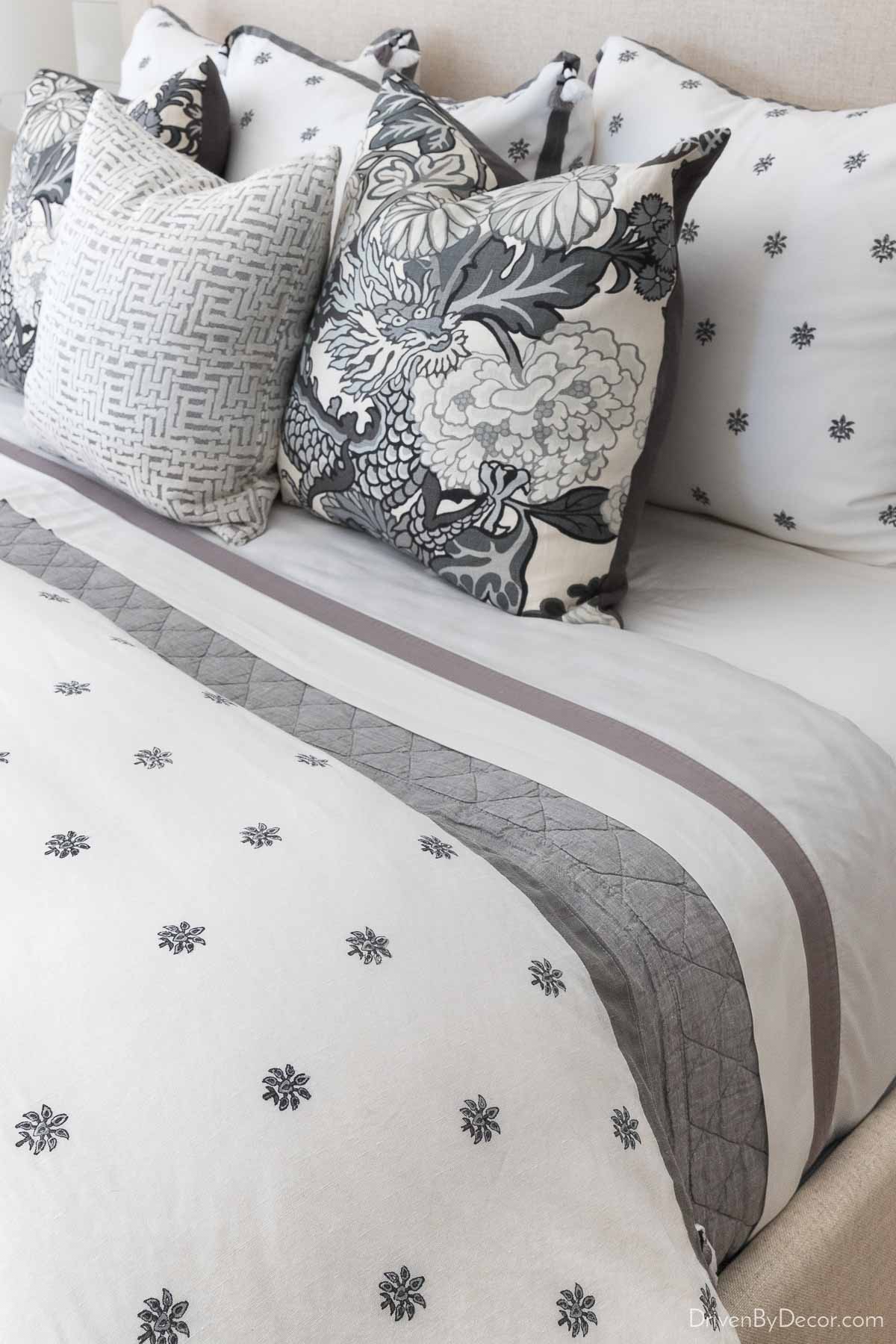 My favorite quilt for guest room bedding - gray color with white sheets and duvet
