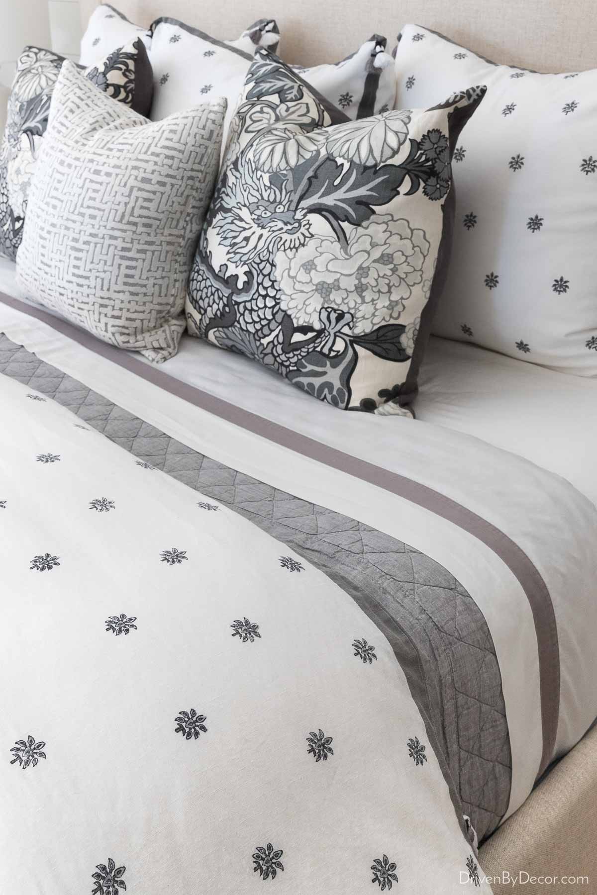 https://www.drivenbydecor.com/wp-content/uploads/2018/08/guest-room-bedding-quilt-gray.jpg