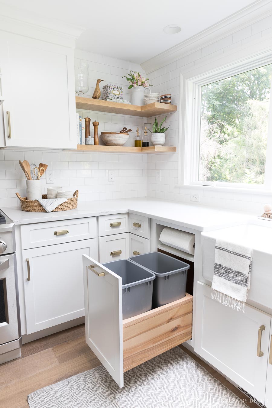 Pull-out kitchen trash can cabinet with two trash bins AND a built-in paper towel holder - I need this in my new kitchen!