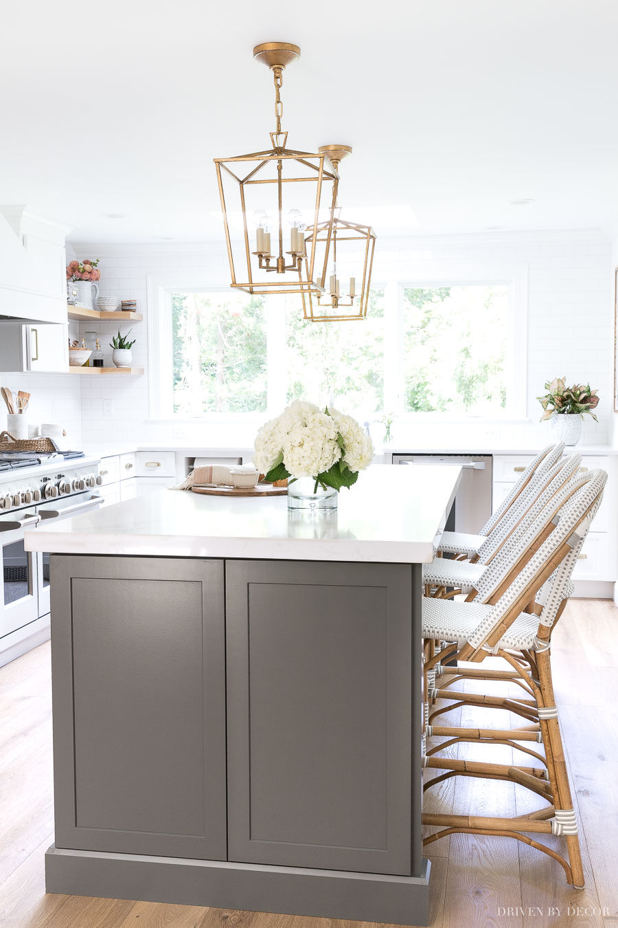 Love the color of this long, dark gray kitchen island with counter height seating!