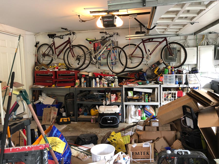 Our horribly messy garage before with organized it with The Container Store's Elfa system