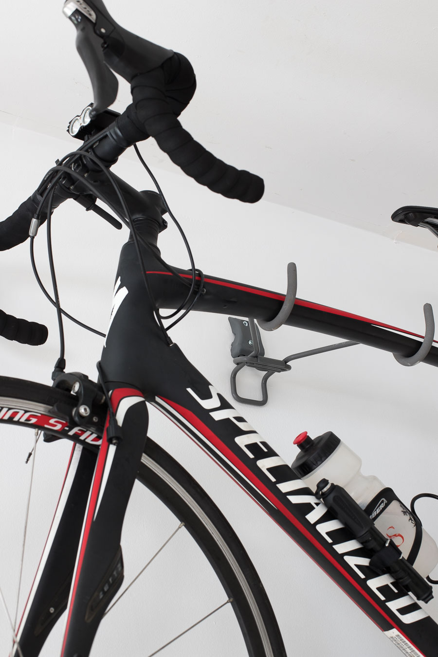 A smart way to hang your bike on the wall in the garage - an Elfa wall-mounted bike rack!